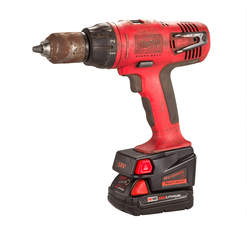 Milwaukee M18 to Milwaukee V18 Ni-Cd battery adapter - installed on a drill over the battery, three-quarter view